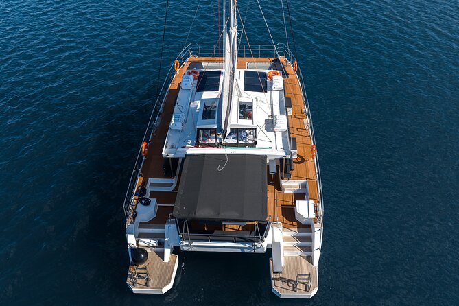 Comfort Max Catamaran Caldera Cruise with BBQ and Drinks - Sailing out of Ammoudi Bay