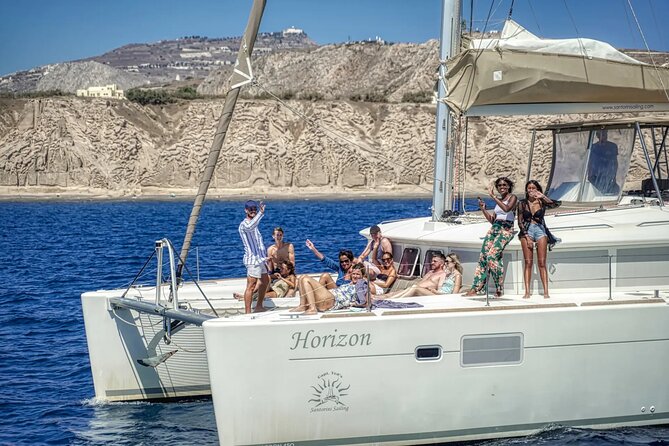 Deluxe Santorini Sailing with BBQ and Drinks Shared Tour - Passing the lighthouse and Indian Head Mountain