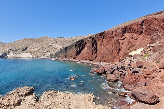 Exclusive Private Santorini Tour Fully Customizable Experience - Perissa makes room for a swim and lunch