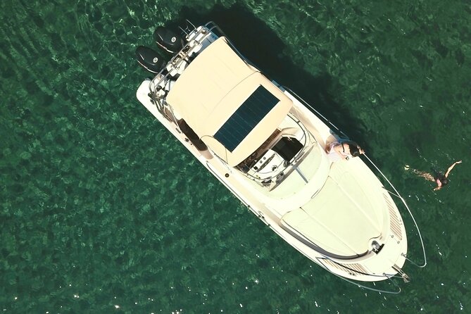 Explore Santorini and its volcanic wonders with Alex Private Boat - Nea Kameni and the warm sulfur water
