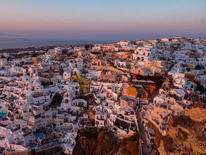 From Fira: Santorini Highlights Minibus Tour with Oia Sunset - Perissa gives you the day’s longest pause