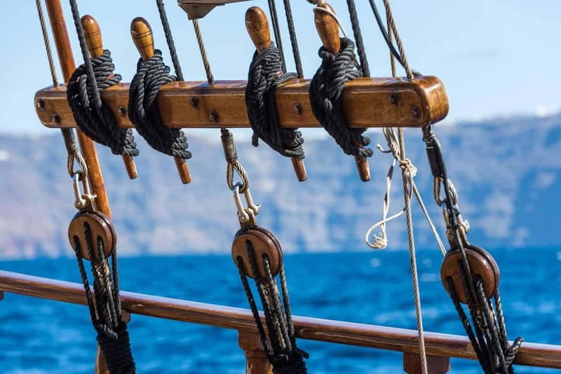 From Santorini: Volcano Cruise With Oia Sunset - Leaving Athinios Port by boat