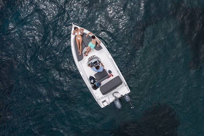 Full Day Boat Rental Without a License in Santorini - Taking the helm from Vlichada at 10am