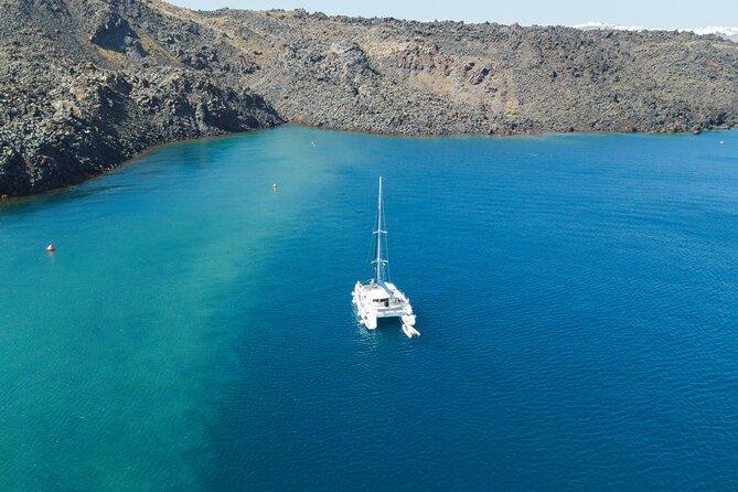 Full Day Santorini Catamaran Private Cruise with meal and transfer - Oia, Fira, and the Caldera From Below