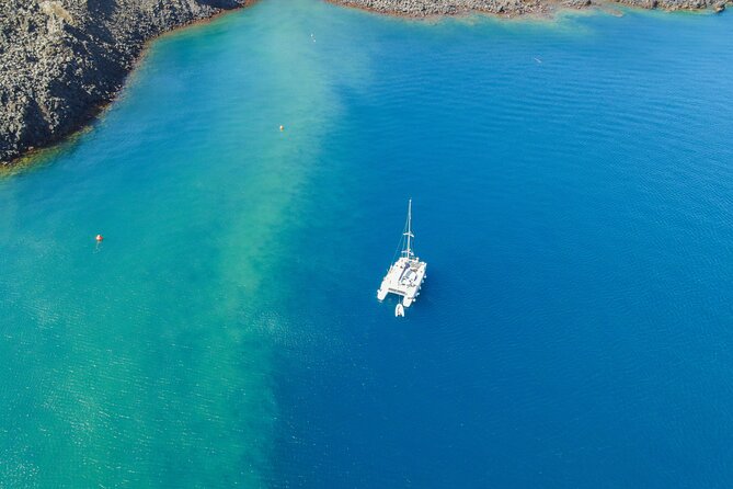 Full Day Santorini Catamaran Private Cruise with meal and transfer - Food, Music, and the Crew