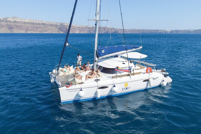 Full Day Santorini Catamaran Private Cruise with meal and transfer - The Faros Lighthouse and Indian Head Rock