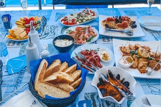 Half-Day Exclusive Catamaran Cruise in Santorini with Meal and Open Bar - Thirassia: swimming time and the main meal