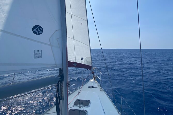 Half day Private Sailing cruise in Santorini island up to 6 pax - Red Beach: striking colors and a short swim