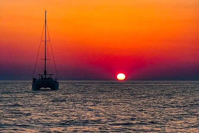 Luxury Small-Group Catamaran Cruise with BBQ, Open bar & Transfer - Sailing past Thirasia and the volcanic caldera