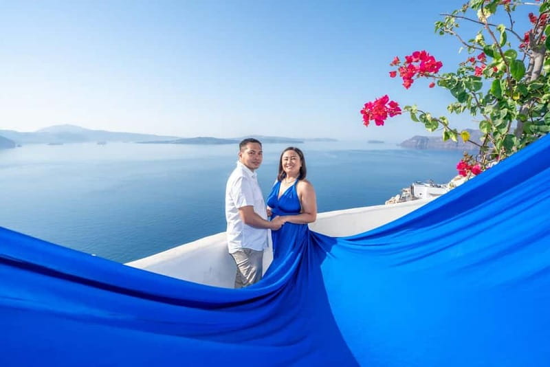 Oia: Santorini Photoshoot with Flying Dress Rental Option - Finishing by the blue domes and caldera