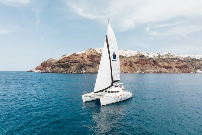 Private Morning Tour Lagoon 400-380 Sailing in Santorini ,lunch, drink, transfer - Why seeing Santorini from a catamaran matters