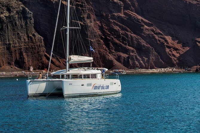 Private Morning Tour Lagoon 400-380 Sailing in Santorini ,lunch, drink, transfer - Red Beach for a final swim