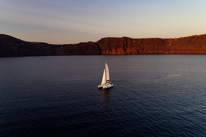 Private Sunset Cruise with Dinner and Drinks! - The volcano stop brings Santorini’s geology close