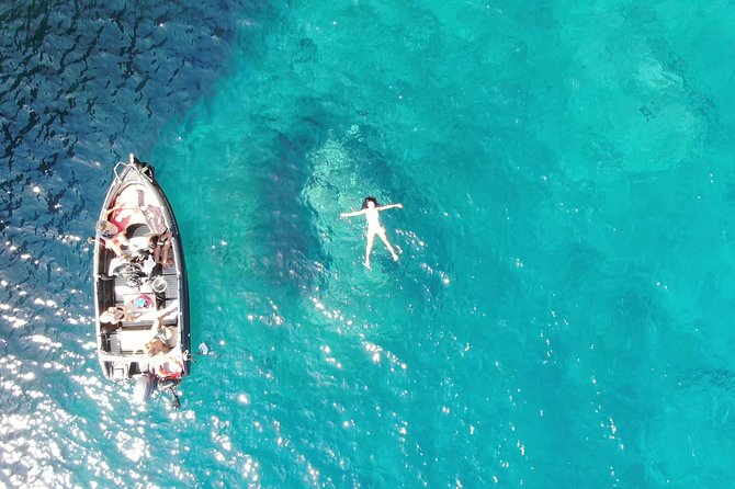 Rent a Boat in Santorini without a License - Taking the wheel at Vlichada