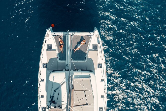 Romantic Sunset Catamaran Caldera Cruise incl. Meal & Drinks - Sailing toward Oia at sunset