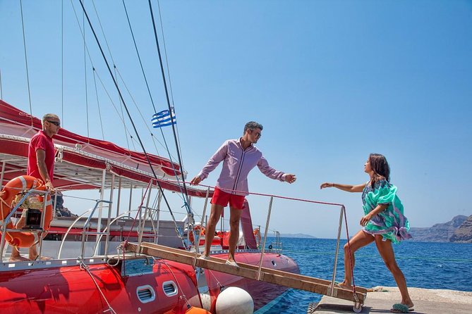 Sailing Catamaran Cruise in Santorini with BBQ, Drinks and Transfer - White Beach, BBQ, and a Longer Swim