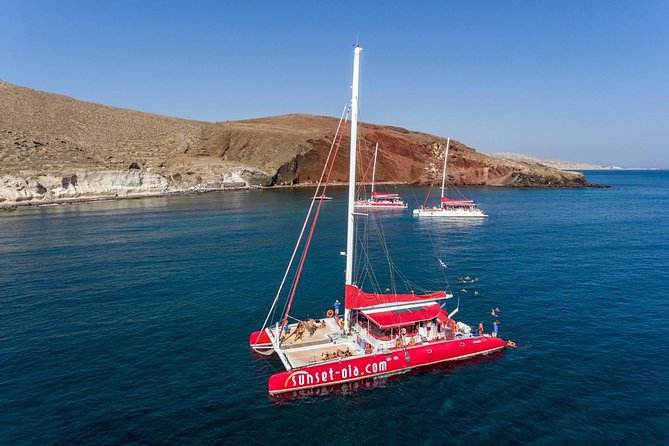 Sailing Catamaran Cruise in Santorini with BBQ, Drinks and Transfer - Sailing Beneath Santorini’s Caldera