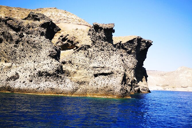 Sailsational Luxury Santorini Catamaran Sunset Cruise with Dinner - Returning past Vlychada after sunset