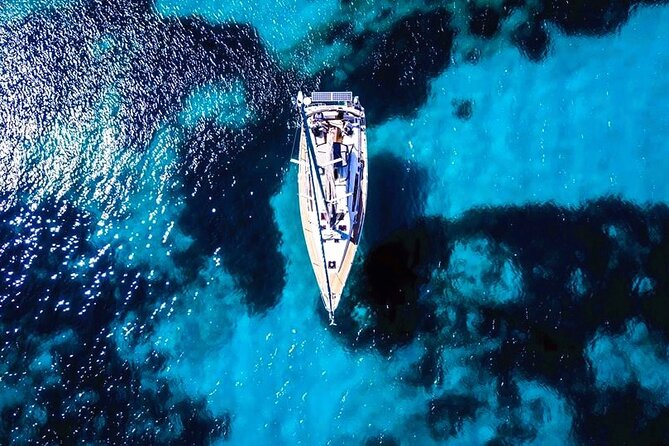 Sailsational Luxury Santorini Catamaran Sunset Cruise with Dinner - Red Beach, where Santorini turns red and black