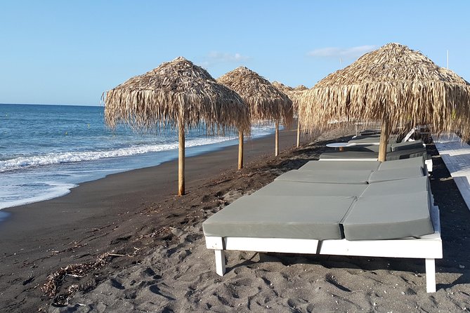 Santorini: 4hr Small Group Shore Excursion with Minimum Walking - Kamari Beach adds black sand and a change of pace