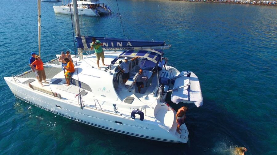Santorini: 7-Hour Private Catamaran Cruise with Food & Drink - Red Beach and White Beach from the water