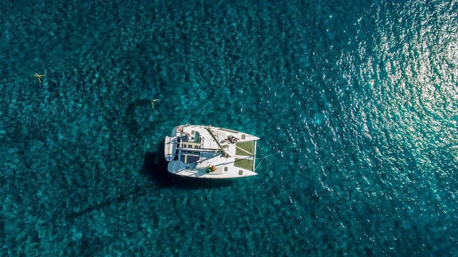Santorini: 7-Hour Private Catamaran Cruise with Food & Drink - The lighthouse, Aspronisi, and Thirassia