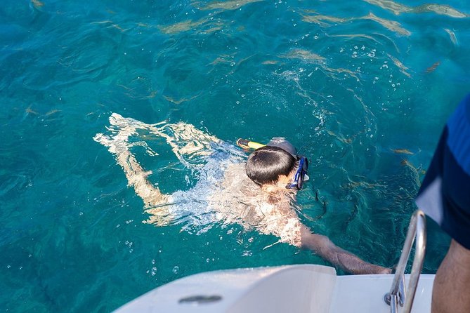 Santorini: Adventurous Catamaran Experience with Snorkeling - Lunch, wine, and the social side of the boat