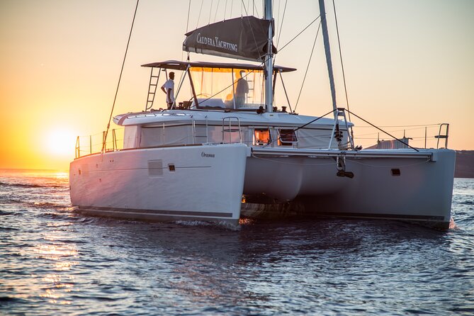 Santorini:All-inclusive Catamaran Cruise with Thirassia Stop - Red Beach and White Beach show Santorini’s volcanic colors
