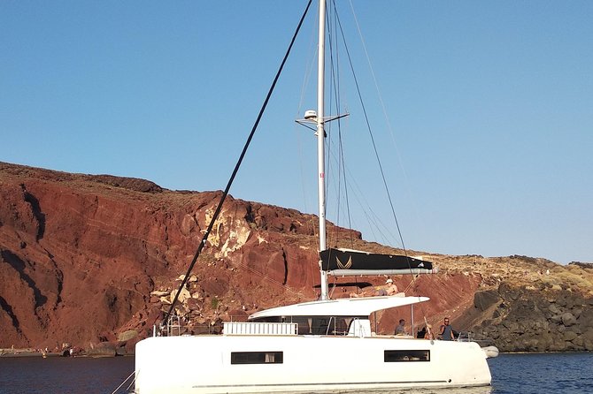 Santorini All-inclusive Private Catamaran Cruise - Red Beach: volcanic color from the water