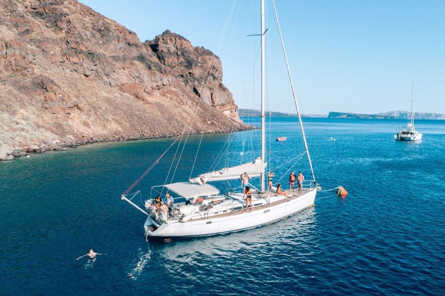 Santorini Caldera: Morning Sailing Cruise with Meal - Passing Akrotiri Lighthouse and entering the caldera