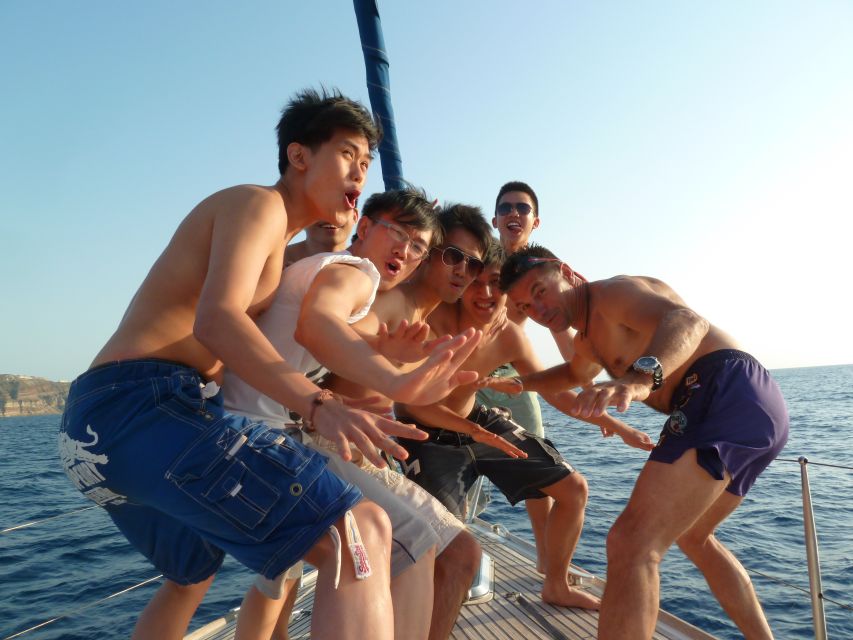 Santorini Caldera: Morning Sailing Cruise with Meal - Volcanic islands, dark beaches, and lunch at anchor