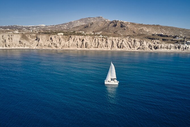 Santorini: Caldera Private Catamaran Cruise with Meal & Drinks - White Beach and Mesa Pigadia’s black shore