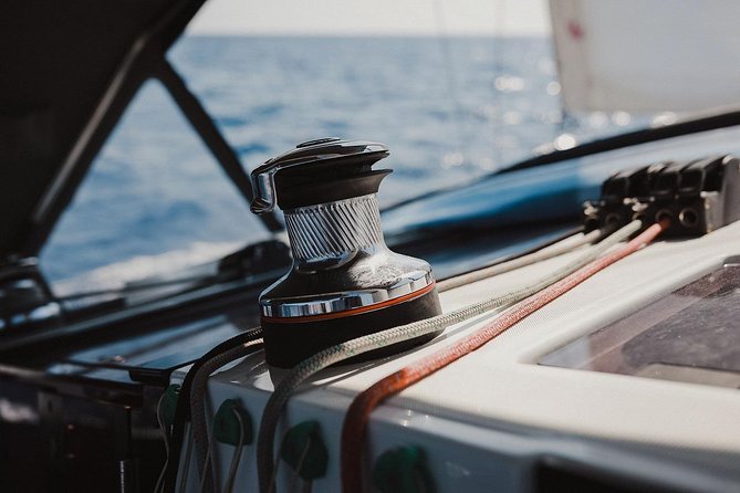 Santorini Caldera Private Sailing Boat Cruise - The Akrotiri lighthouse and volcanic rock