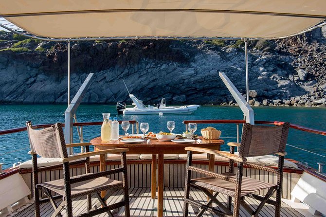 Santorini Caldera Sunset Traditional Cruise with Meal and Drinks - Thirassia combines a swim with dinner