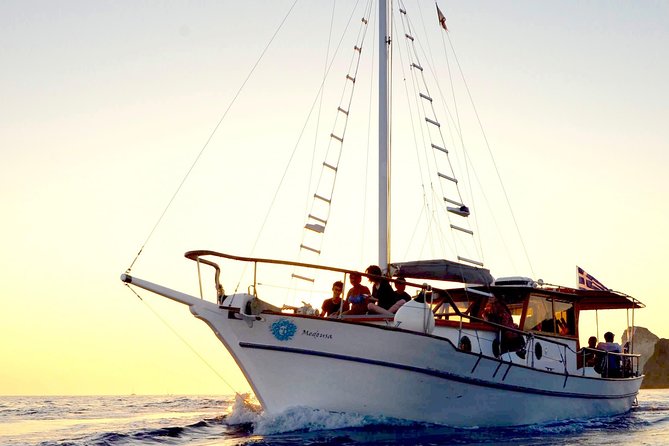 Santorini Caldera Sunset Traditional Cruise with Meal and Drinks - White Beach is reached only from the sea
