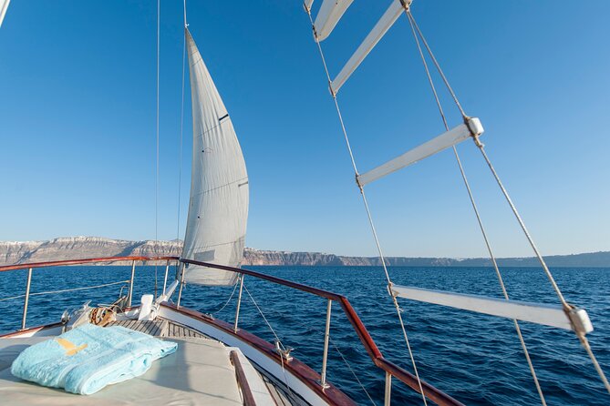 Santorini Caldera Sunset Traditional Cruise with Meal and Drinks - Red Beach offers the boldest colors