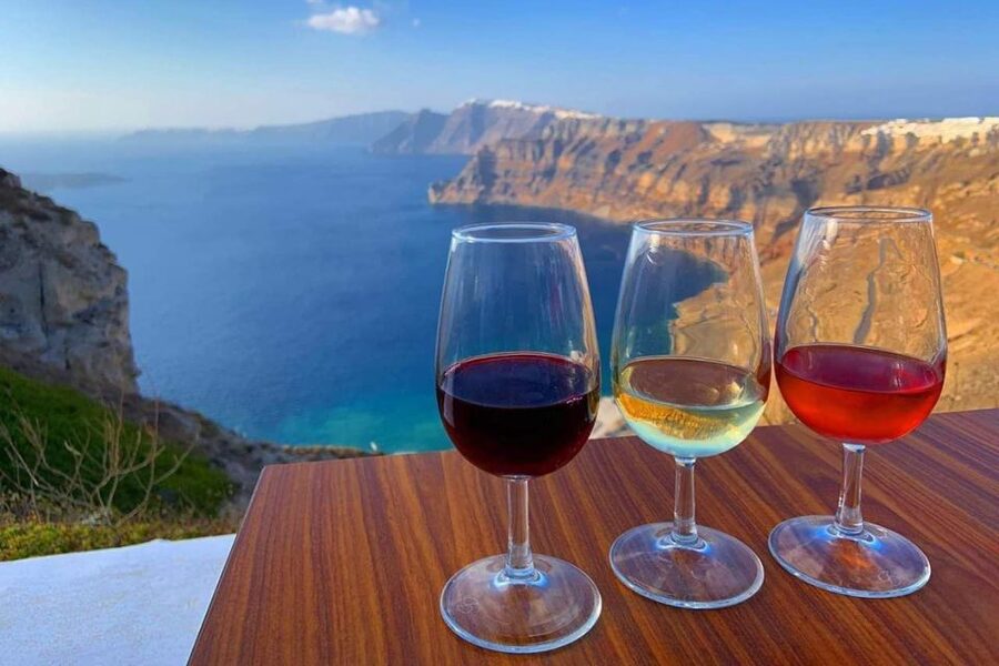 Santorini: Catamaran Cruise, Winery, & Oia Sunset Combo Tour - Oia sunset from a reserved seat