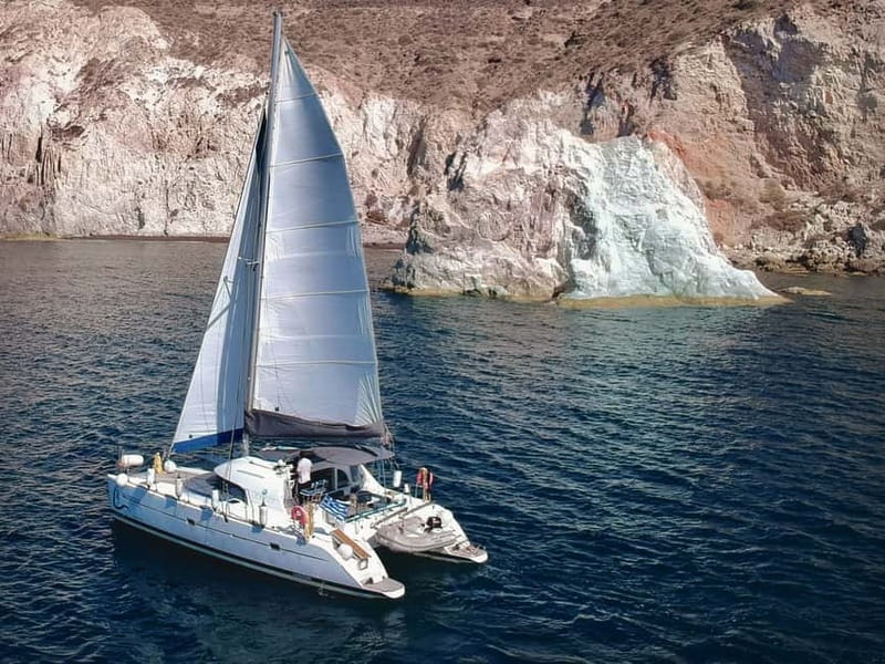 Santorini: Catamaran Cruise with Food and Drinks - White Beach, Indian Rocks, and the Lighthouse