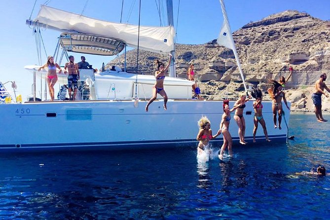 Santorini Catamaran Cruise with Fresh Meal and Open Bar - White Beach and the Akrotiri coast