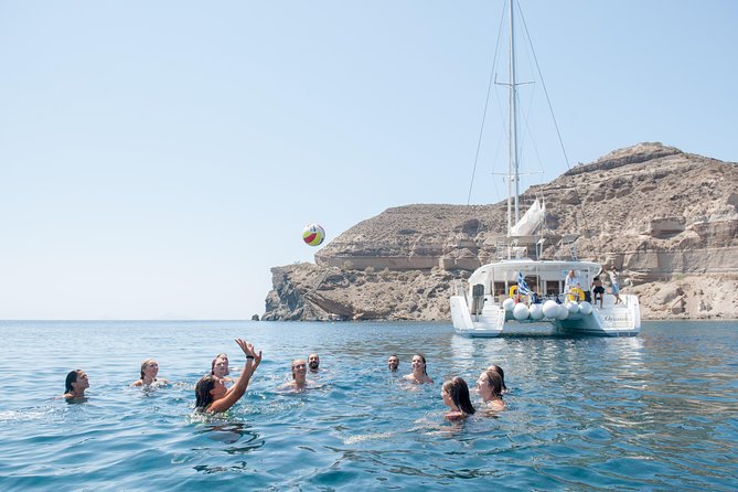 Santorini Catamaran Cruise with Fresh Meal and Open Bar - An open bar with a party, not a nightclub, mood