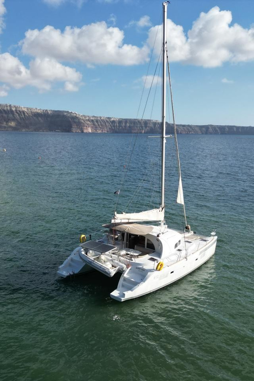 Santorini: Catamaran Cruise with Greek BBQ and Drinks - Indian Rocks and the Venetian Lighthouse