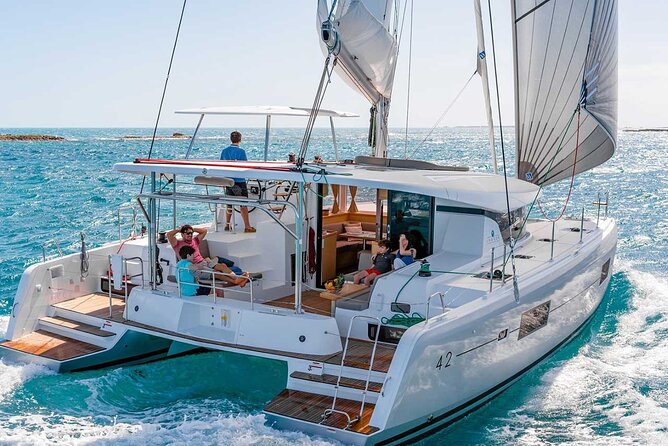 Santorini Catamaran Cruise with Greek Meal, Open-Bar and Sunset - Leaving the port and meeting the crew