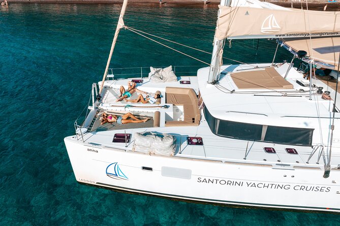 Santorini Catamaran Cruise: with Lunch, BBQ, Open Bar, Transfers - White Beach, Indian Rocks, and the Venetian Lighthouse