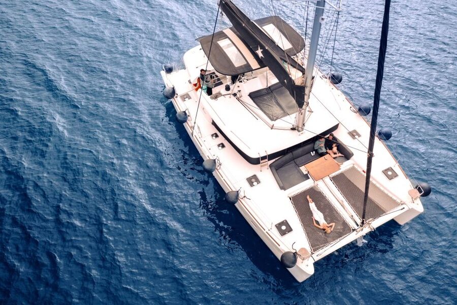 Santorini: Catamaran Cruise with Lunch, Drinks, & Oia Visit - Oia and Ammoudi Bay from the water