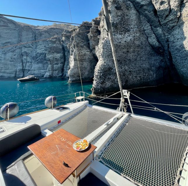 Santorini Catamaran Cruise with Swimming, Meal and Open Bar - The crew and onboard mood