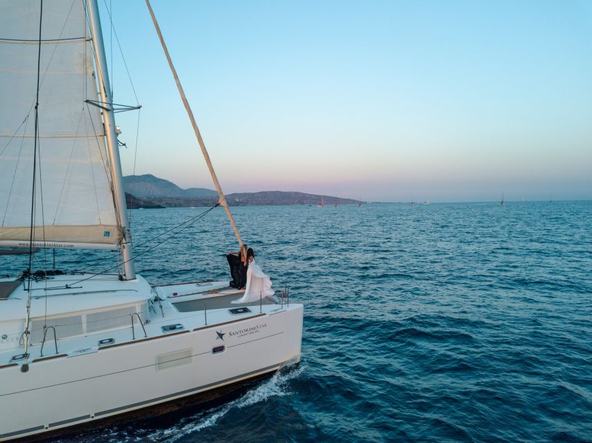 Santorini Catamaran Cruise with Swimming, Meal and Open Bar - Leaving Vlychada and passing White Beach