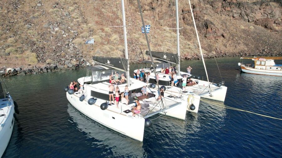 Santorini Catamaran Cruise with Swimming, Meal and Open Bar - Red Beach for a first swim