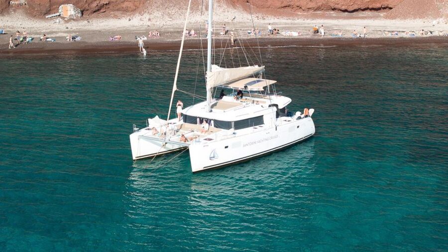 Santorini Catamaran Day Cruise: Lunch, Drinks and Transfers - Boarding the catamaran and settling in