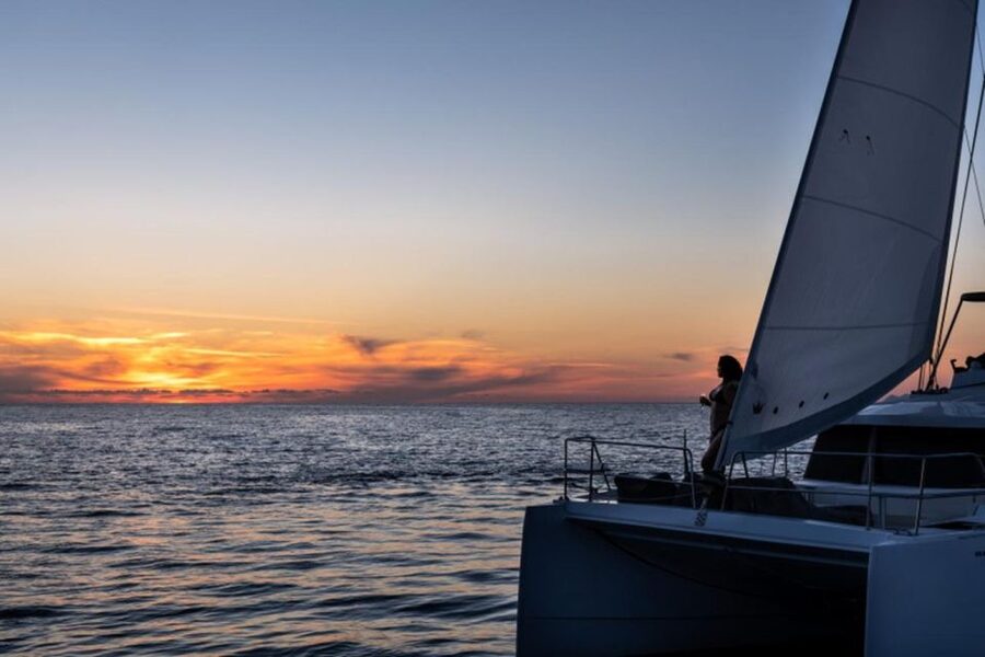 Santorini Catamaran Sunset Skyline Cruise - White Beach and Mesa Pigadia show another side of the coast