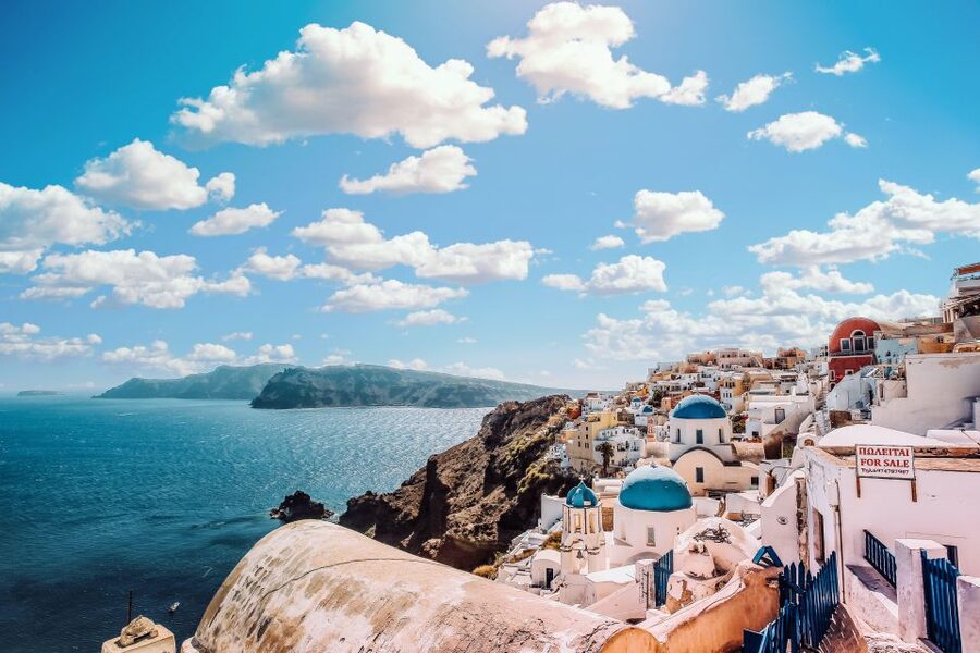 Santorini Catamaran Sunset Skyline Cruise - The Akrotiri Lighthouse marks the turn into the caldera